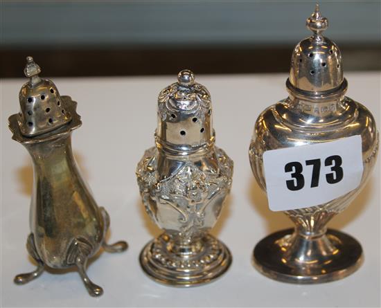 Three silver pepper pots